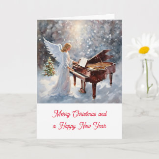 Kerstengel achter de piano kort