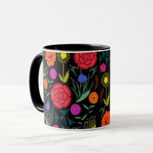Klara färgglada blommor på svart mugg