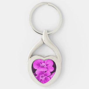 Klara rosa tropiska blommor twisted heart silverfärgad nyckelring