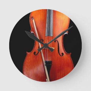 Klassikervioloncell på svart rund klocka