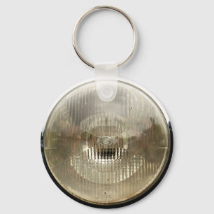 Klassisk bilstrålkastare med rund, genomskinlig gl nyckelring