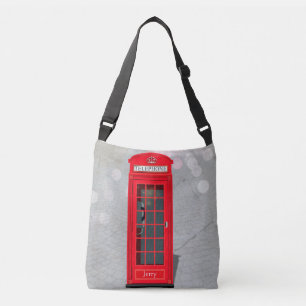 Klassisk London röd telefonkiosk med namn Axelväska