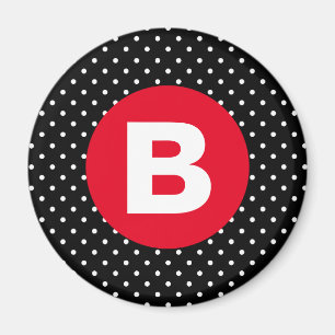 Klassiska svarta och vita prickar med röd monogram magnet