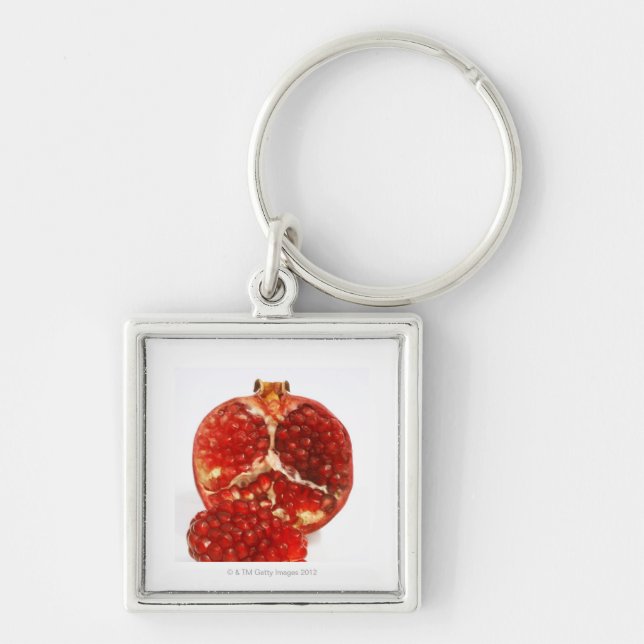Klippte halvan en mogen pomegranate till blottan fyrkantig silverfärgad nyckelring (Framsidan)