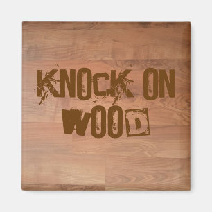 Knackning på den Wood magneten Magnet