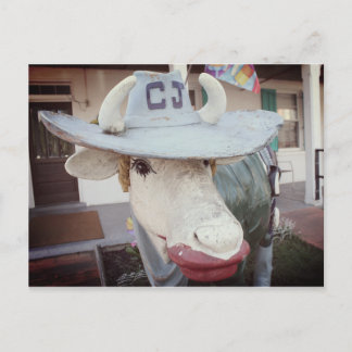 Ko i läppstift på en vykort