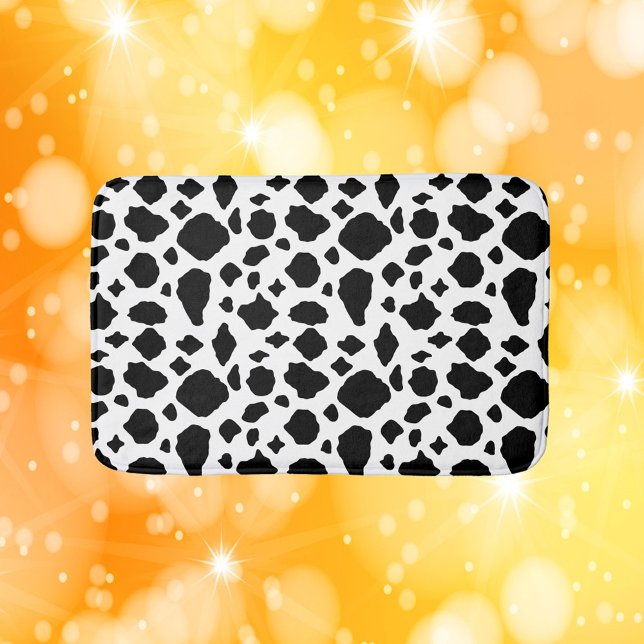 Ko Mustertryck Svart Vitt Lantligt Badrumsmatta (A bath mat with a black and white cow pattern.)