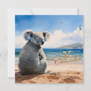 Koala på en sandstrand God jul Julkort