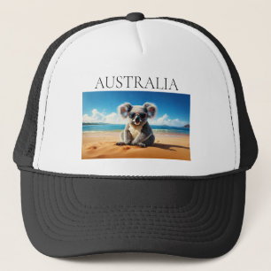 Koala på en sandstrand keps