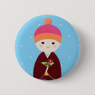 Kokeshi docka med camelliaen knapp