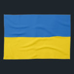 Kökshandduk med Flagga från Ukraina<br><div class="desc">Ta med dig ett handtag av ukrainskt pride till ditt kök med den här vibrerande kökshandduken med Ukrainas flagga! Den här kökshandduken är uppgjord med uppmärksamhet på detaljer och är mer än bara en praktisk fråga. Den är en firande av ukrainsk kultur och arv. Den djärva utformningen visar stolt på...</div>