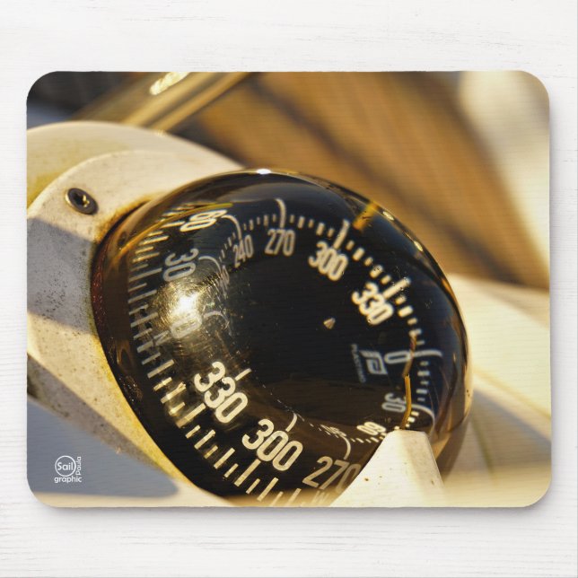 Kompas helpt navigeren en koer behouden.  musmatta (Framsidan)