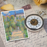 Konstnärens Garden vid Vétheuil av Claude Monet Vykort<br><div class="desc">Konstnären i Vétheuil målar av Claude Monet med ett litet barn som står framför oss på ett väg med sol-dappade som springa i mitten av en trädgård som domineras av torkad gult och solblommor med bränd orange. Bakom barnet står en kvinna och ett annat barn på fotstegen. Kvinnan bär en...</div>