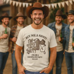 Köp mig ett Shot Tying Knot Cowboy Bachelor Party T Shirt<br><div class="desc">Den här söta skjortan är perfektens gåva till brudgummen att vara på hans reklamfest. Den har en söt western temadesign med vintagens slitande text som läser Köp mig en Shot! Jag Gifter sig! Det finns en cowboystövel, hatt och lassorep som bildar formen av ett hjärta. Underliggande är hans namn och...</div>