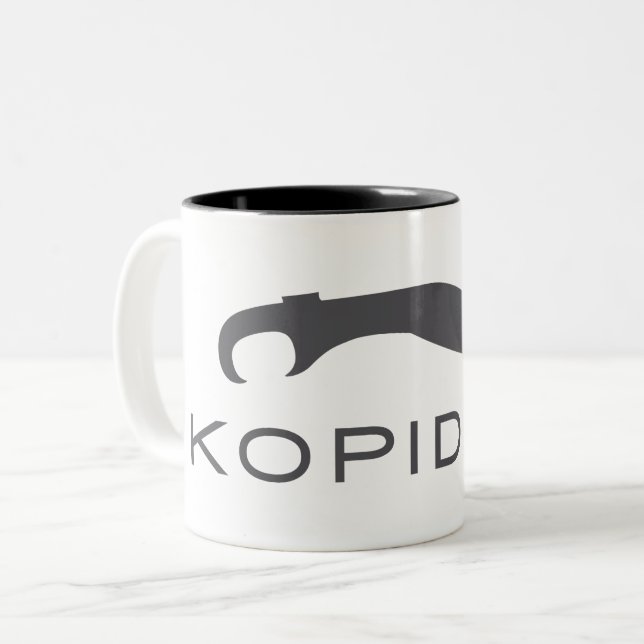 Kopidion-svärd logotyp kaffe mugg (Framsida vänster)