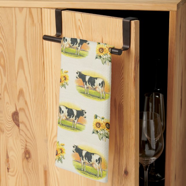 Kor och solrosor på textil med veckat linne kökshandduk (Thirds Fold)