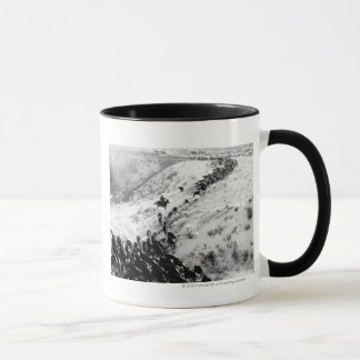 Körning av nötkreatur i winter.en mugg