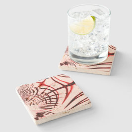 Korsade röda kurvspår på ljusbakgrund stenunderlägg