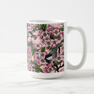 Körsbärsblom och mesar på rosa kaffemugg