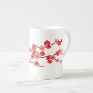 Körsbärsröd blommarbenporslinmugg benporslin mugg