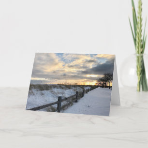 Kort för hälsning för solnedgångvinterstrand tomt