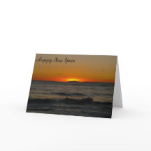 Kort-Solnedgång för affärssäsonghälsningar vid hav