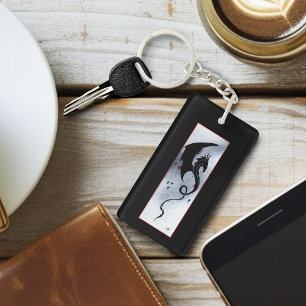 Kraftfull svart tribal-drake röda blå blommor logo