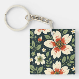 Krämfärgade blommor med röda centra & gröna blad