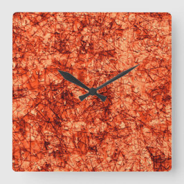 Kratser på repor på en lätt fläckig korall fyrkantig klocka