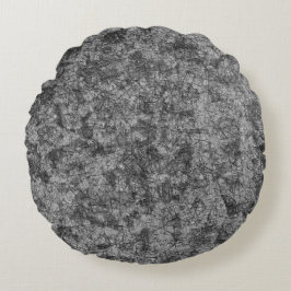 Krepor på repor på ett lätt fläckat grått rund kudde