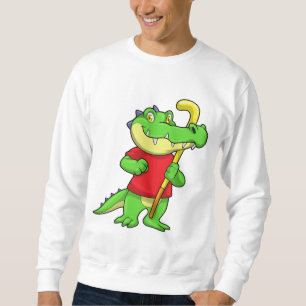 Krokodil på landhockey med käpp lång ärmad tröja