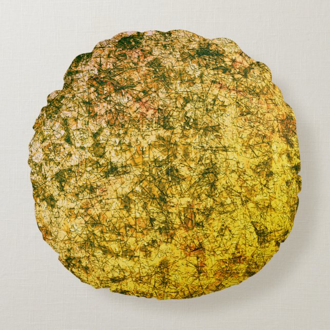 Krymp på en lätt fläckig  gult rund kudde (Framsidan)