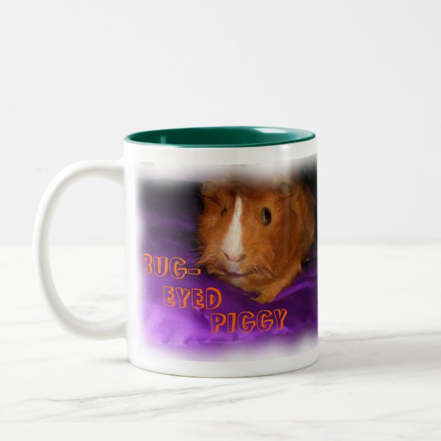 KRYP-EYED PIGGY Guinea Mugg (Vänster)