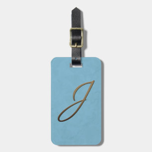 kursivt monogram - J Bagagebricka