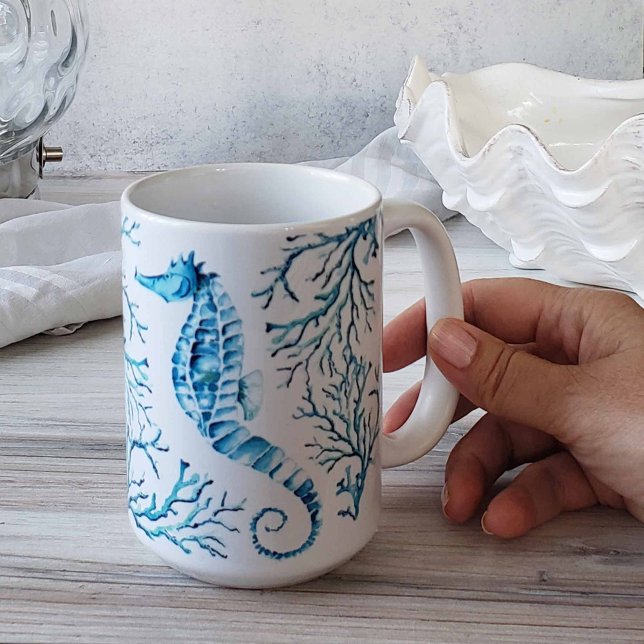 Kustblåsjöhäst och korallvattenfärg kaffemugg (Beach-themed coffee mugs feature unique blue seahorse art by Victoria Grigaliunas of Do Tell A Belle)