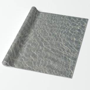 Kvarter och sand vid Vatten vid havet Presentpapper