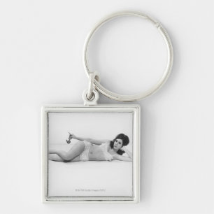 Kvinna i baddräkt fyrkantig silverfärgad nyckelring