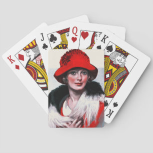 Kvinna i röd hatt spel kort