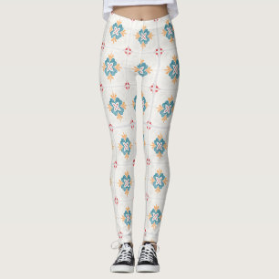 Kvinna som bär vita leggings med en färgrik