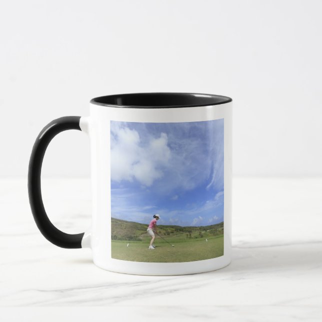 Kvinna som leker golf mugg (Vänster)