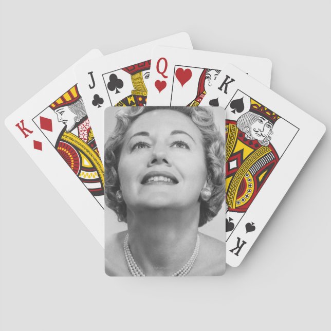 Kvinna som tittar upp kortlek (Baksidan)