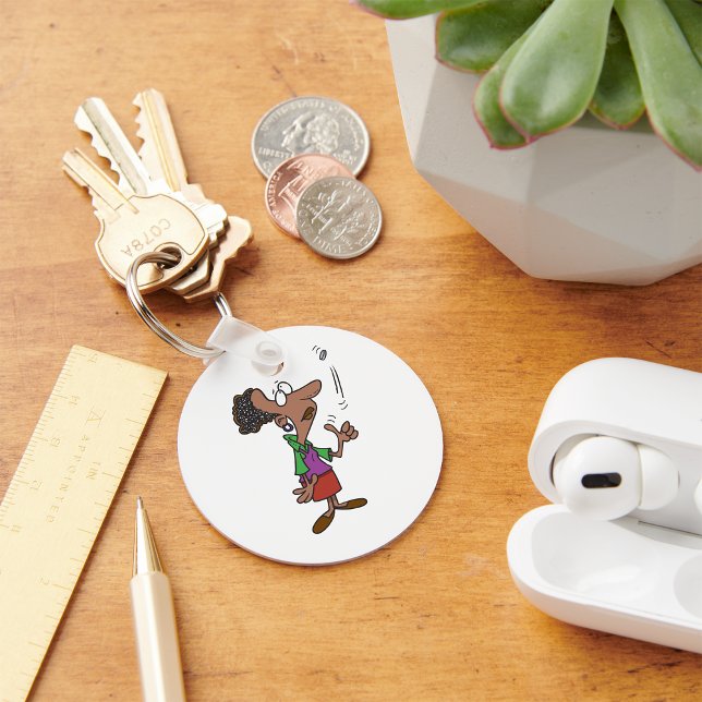 Kvinna som vänder ett mynt nyckelring (Skapare uppladdad)