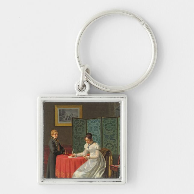 Kvinnahandstil ett brev fyrkantig silverfärgad nyckelring (Framsidan)