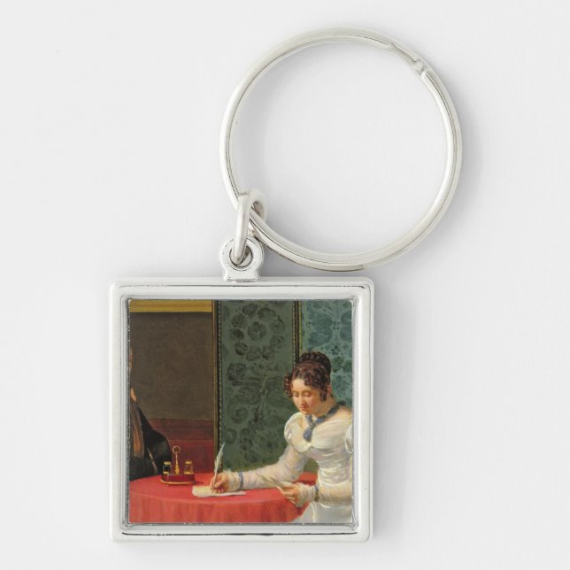 Kvinnahandstil ett brev fyrkantig silverfärgad nyckelring (Framsidan)
