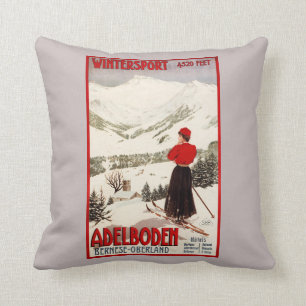 KvinnaSkier som förbiser den Adelboden affischen Kudde
