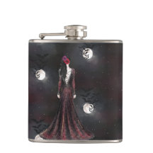 KVINNOR SOM STÅR I EN FÅGELKVÄLL NÅGOT HIMLAR MED