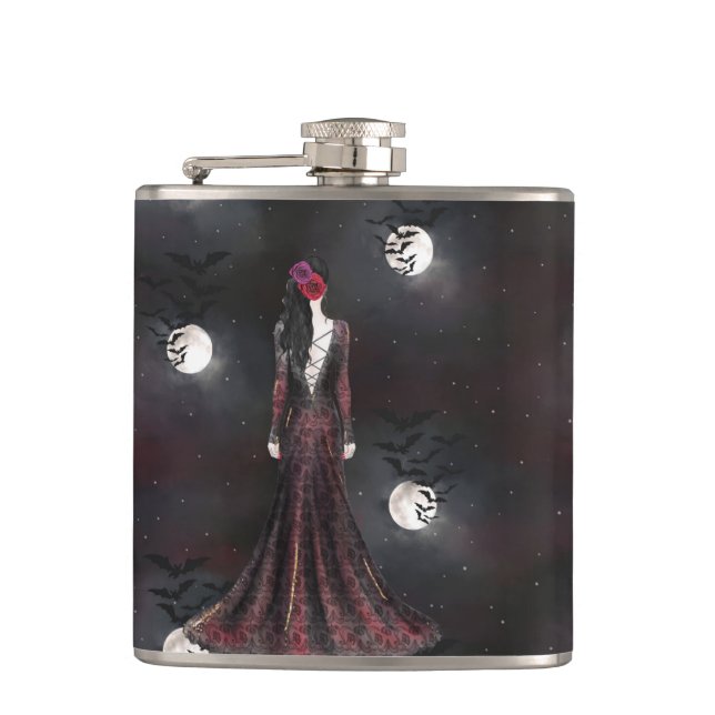 KVINNOR SOM STÅR I EN FÅGELKVÄLL NÅGOT HIMLAR MED  FICKPLUNTA (Framsidan)