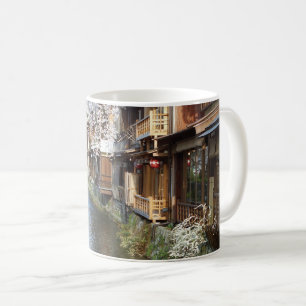 Kyotoprotokollets traditionella teorier kaffemugg