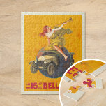 La 15hp Bellanger | Leonetto Cappiello Pussel<br><div class="desc">La 15hp Bellanger (1921) | Leonetto Cappiellos reklamprogram från 1921 poster för La 15hp Bellanger uppmärksammar med en djärv och uppfinningsrik utformning. Den har en kvinna i en blomstrande gult som sitter på en glob och som blåser ett horn för att förända en Bellanger-bil, som dramatiskt sprider sig genom jorden....</div>