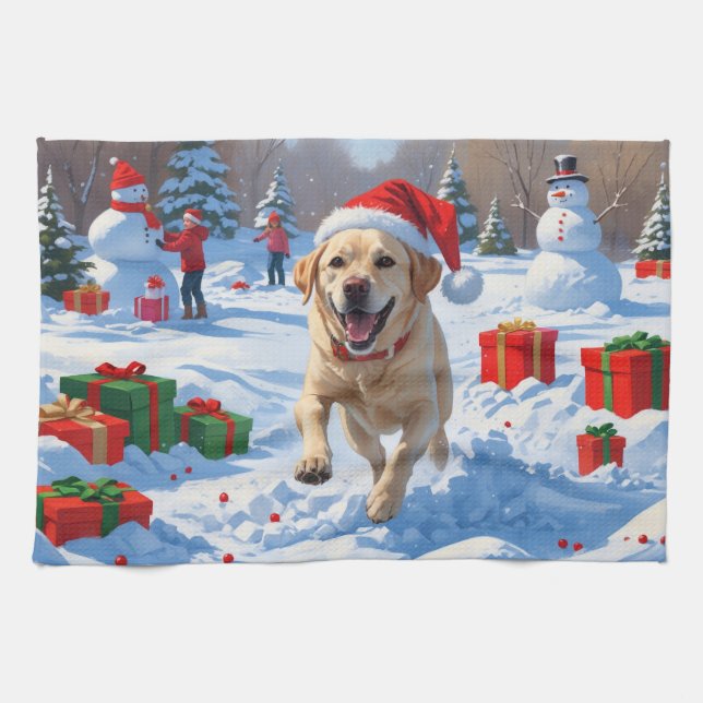 Labradorhund springer i snö med julhatt kökshandduk (Horisontell)